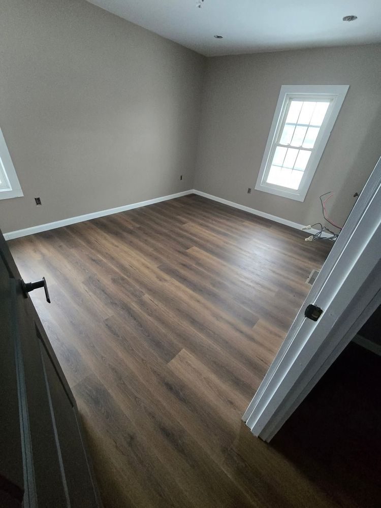 Bedroom after: new flooring, fresh paint, trim and finished ceiling