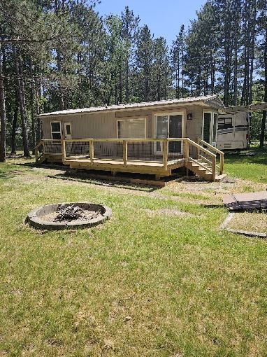 Custom wood deck build on a cabin
