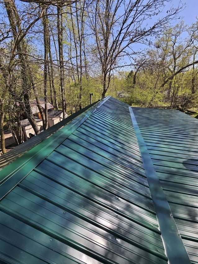 Green standing-seam metal roof installation